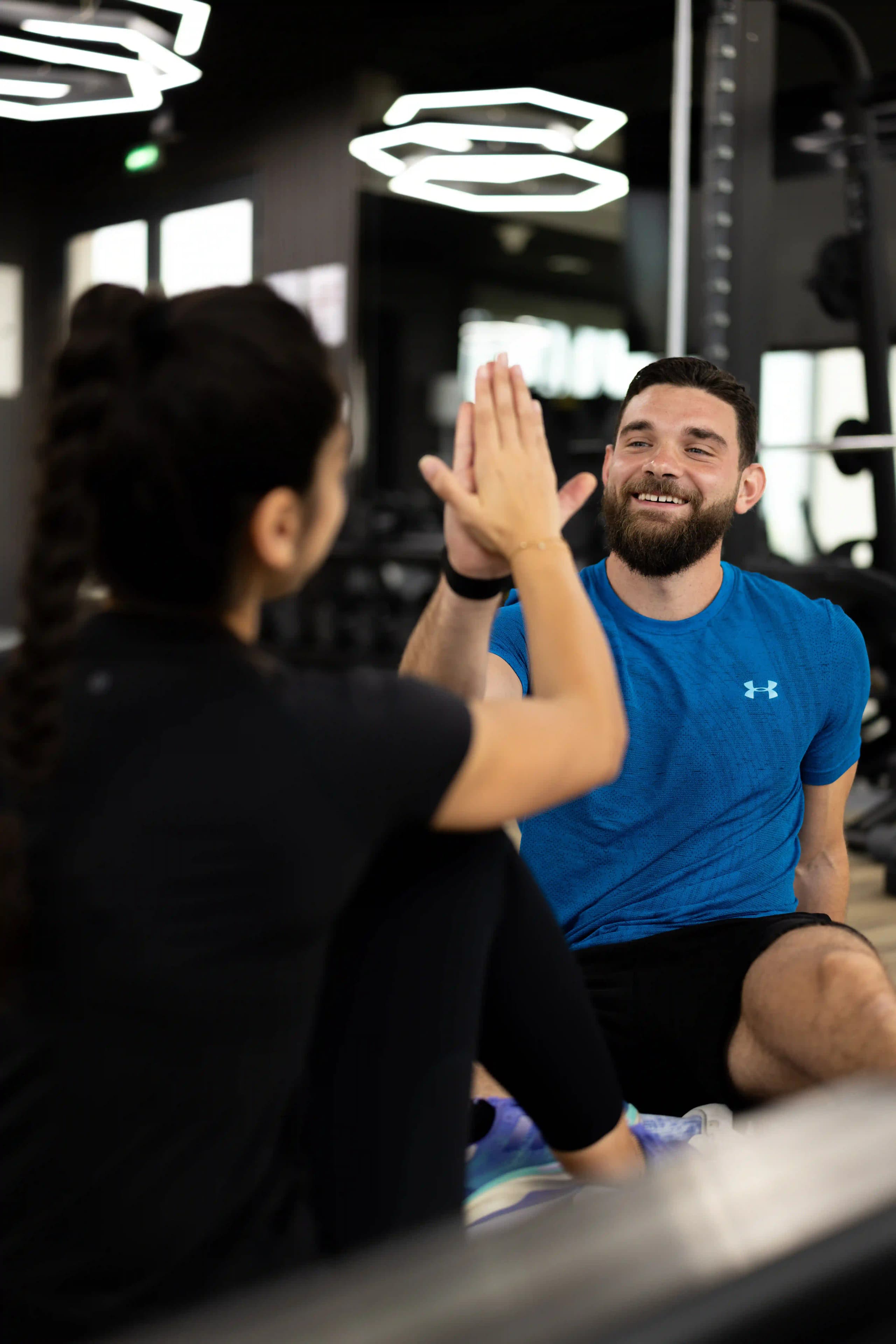 everybody fitness coach celebrating client progress during personal training session in Dubai