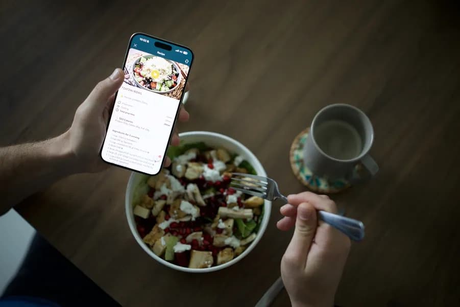 Healthy meal and fitness tracking app showing calorie and nutrition data for weight loss
