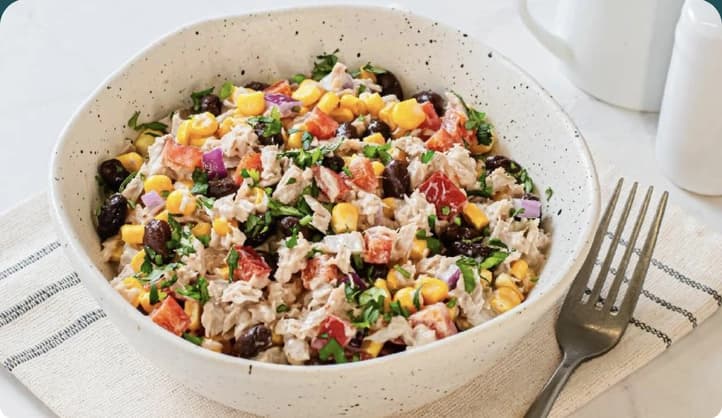 A colourful, balanced meal from the everybody nutrition guidance feature, showing real coach-recommended food built into every plan.